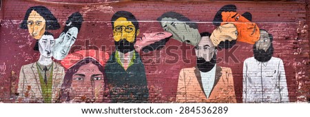 MOSCOW, RUSSIA, 02 JUNE 2015: Graffiti wall urban art many faces, made on Red October during the \