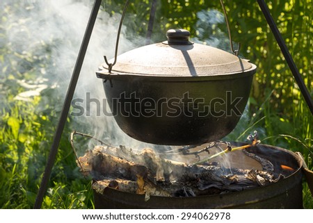 Cooking in the cauldron on fire