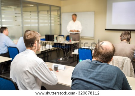 The audience listens to the acting in a computer classroom