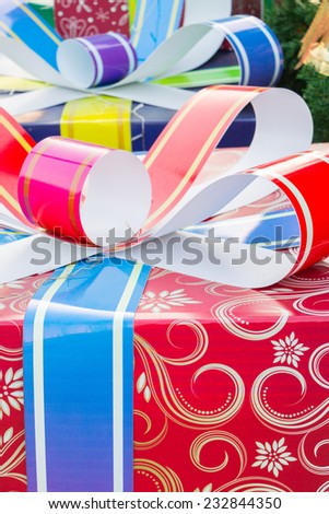 Colorful and striped boxes with gifts tied bow