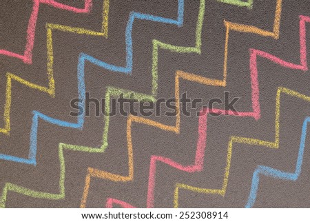 Hand drawn zigzag lines on chalkboard background