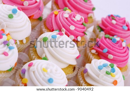 pink and white mini cupcakes with sprinkles
