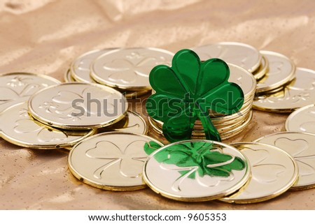 gold coins with green shamrock on gold metallic cloth