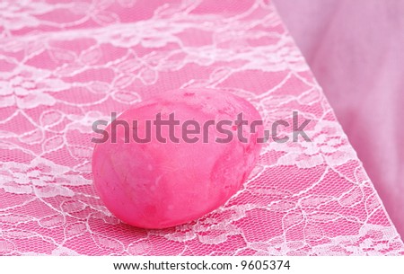pink chalk easter egg on a pink lace covered wine gift bag