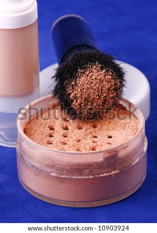 Liquid foundation and loose powder make-up with brush