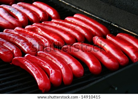 red hot dogs on a barbecue grill