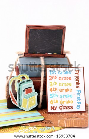 miniature wooden books with school stickers, folders and backpack