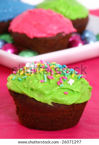 Brightly decorated and iced low fat chocolate cupcakes