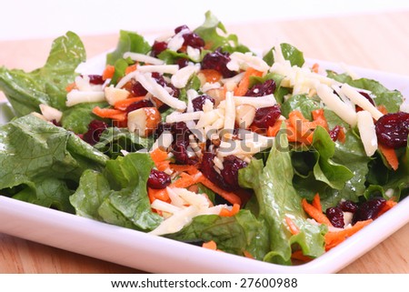 close up of a plate full of cranberry, carrot almond salad