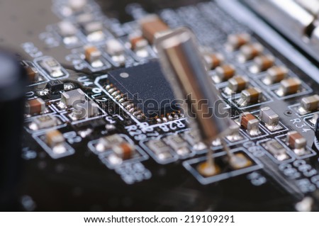 Part of PC electronic circuitr board. Close up with selective focus and shallow DOF.