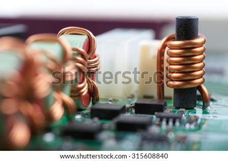 Part of PC main board with electronic components. Shallow DOF.