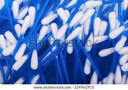 Scattered cotton swabs. Closeup with shallow DOF.
