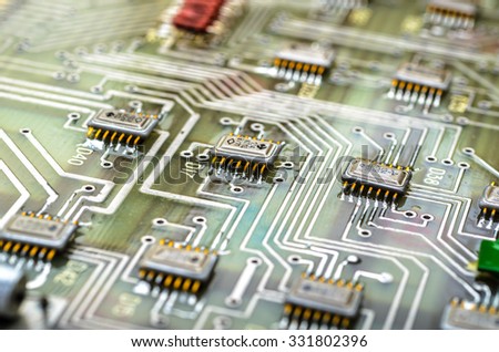 Analog printed circuit board with applied digital effects. Shallow DOF.
