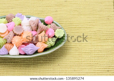 Colorful of Thai style sweet dessert (A-lua) in banana leaf plate on cloth mat . Made from coconut milk and Sugar