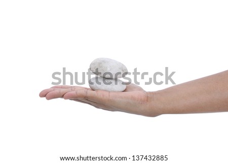 Female hands holding stones in balance isolated on white background