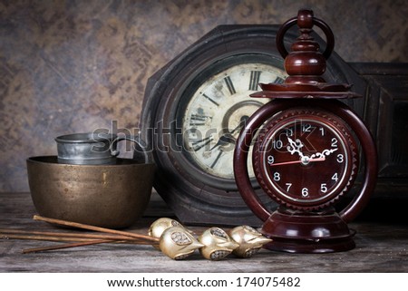 Group of objects on wood table. old clock, antique wooden clock ,Still life