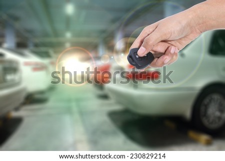 Hand holding remote control car key