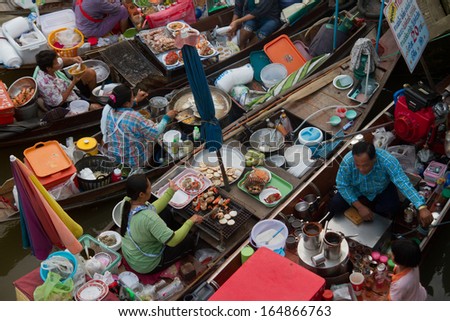 Amphawa Floating Market - December 21, 2012: The most famous floating market in Thailand sees as variety of Thai Traditional Food.