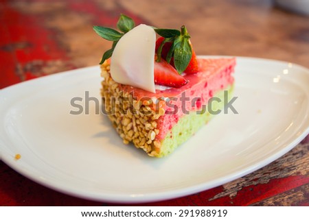 Pink strawberry cheese cake on white dish