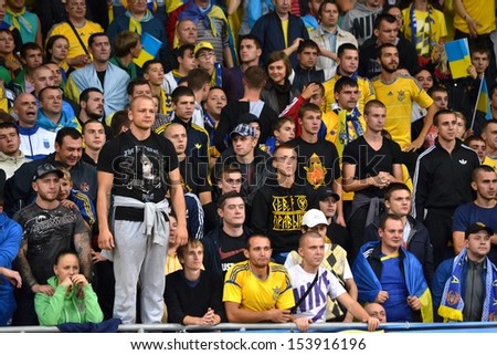 KIEV, UKRAINE - SEP 10: Ultras and fans of Ukraine team at the stadium during the qualifying match 2014 World Cup between Ukraine vs England, 10 September 2013, NSC Olympic Stadium, Kiev, Ukraine