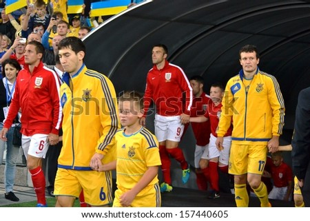KIEV, UKRAINE - SEP 10: Football team of Ukraine and England go on the field during the qualifying match 2014 World Cup, 10 September 2013, NSC Olympic Stadium, Kiev, Ukraine