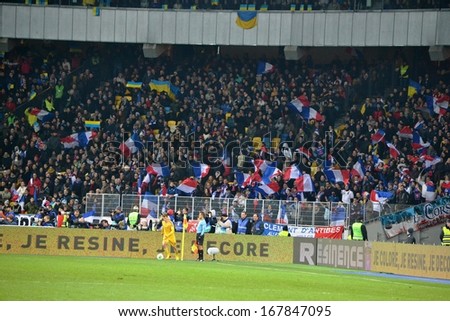 KIEV, UKRAINE - NOV 15: French football fans in the stands during the play-off match for the 2014 World Cup between Ukraine vs France, 15 November 2013, NSC Olympic Stadium, Kiev, Ukraine