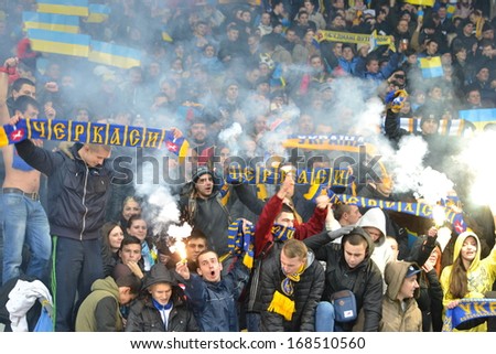 KIEV, UKRAINE - NOV 15: Ukrainian team ultras burn fireworks during the play-off match for the 2014 World Cup between Ukraine vs France, 15 November 2013, NSC Olympic Stadium, Kiev, Ukraine