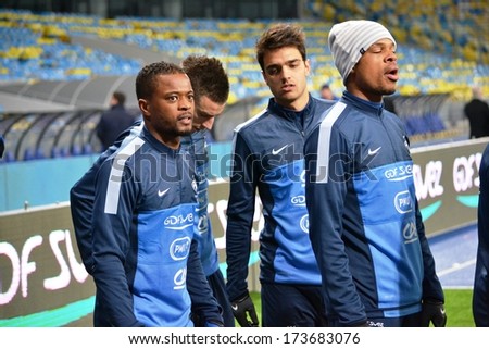 KIEV, UKRAINE - NOV 14: French team and Patrice Evra (L) trains before the play-off match for the 2014 World Cup between Ukraine vs France, 14 November 2013, NSC Olympic Stadium, Kiev, Ukraine