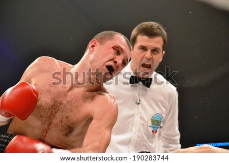 CHERKASSY, UKRAINE - DEC 15: Sergei Fedchenko (L) boxed against Azad Azizov in the fight for the European title by the WBO junior welterweight, 15 December 2012, Budyvelnik, Cherkasy, Ukraine