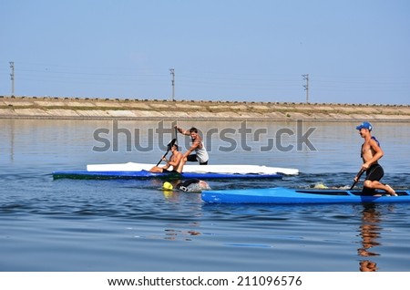 CHERKASSY, UKRAINE - AUG 8: Swimmers rowing during VI International swim across the Dnieper River, 10 km, 8 August 2014, Cherkassy, Ukraine