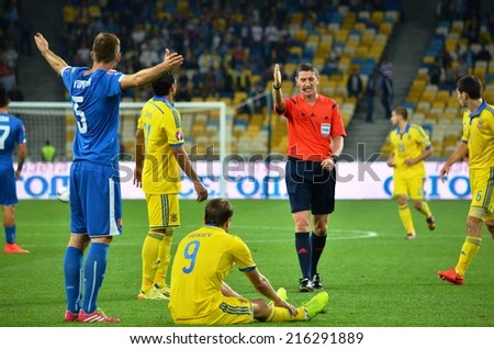 KIEV, UKRAINE - SEP 8: Football players Norbert Domber (L) violated the rules of the game during the match Ukraine 0-1 Slovakia UEFA Euro 2016 qualifier match, 8 September 2014, Kiev, Ukraine