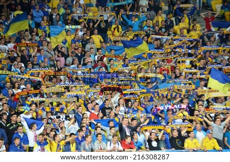 KIEV, UKRAINE - SEP 8: Fans of the Ukrainian team in the stands during the match Ukraine 0-1 Slovakia UEFA Euro 2016 qualifier match at the Olympic stadium, 8 September 2014, Kiev, Ukraine