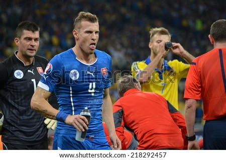 KIEV, UKRAINE - SEP 8: Jan Dyuritsa (L) drink water during the match Ukraine 0-1 Slovakia UEFA Euro 2016 qualifier match, 8 September 2014, Kiev, Ukraine