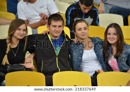 KIEV, UKRAINE - SEP 8: Fans of Ukraine and the girls in the stands during the match Ukraine 0-1 Slovakia UEFA Euro 2016 qualifier match, 8 September 2014, Kiev, Ukraine
