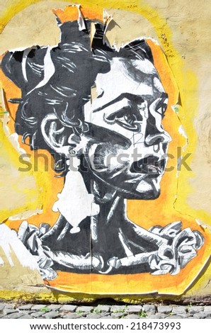 ROME - AUGUST 27, 2014: Girl painted on house wall in Rome, Italy