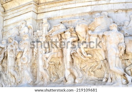 ROME - AUGUST 27, 2014: Relief marble sculpture scene of roman battle expedition. Image taken at Vittoriano monument, Rome, Italy