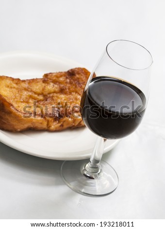 Torrijas are the spanish version of French Toast. Slices of Bread soaked in milk, egg-coated and fried. Typical dessert in Easter Season served with porto wine or sweet sherry