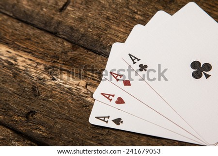 Playing cards on wooden surface