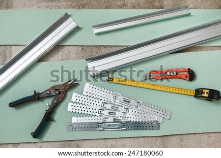 Different instruments and materials for build a plasterboard walls