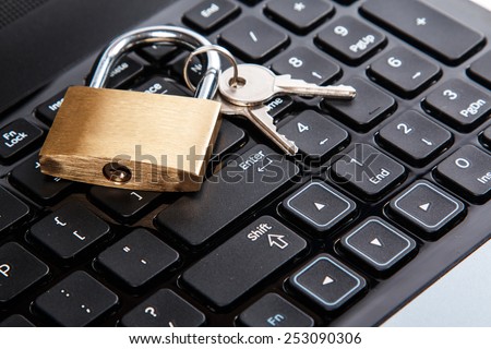 Padlock on a laptop keyboard. Concept of internet security