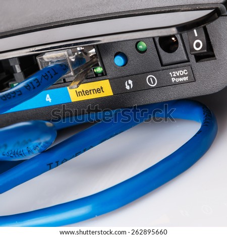Close up of router and ethernet cable