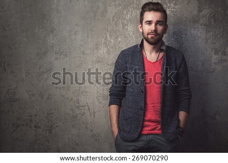 Portrait of handsome guy with beard and stylish haircut