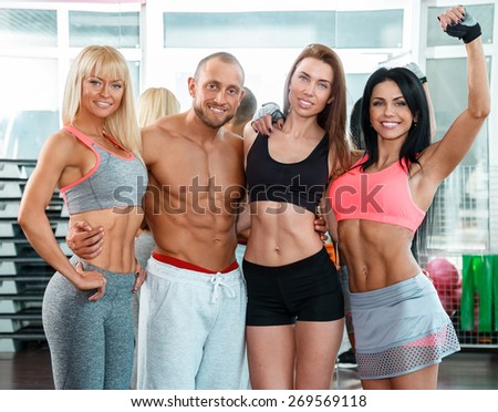 Group of young sporty people in the gym