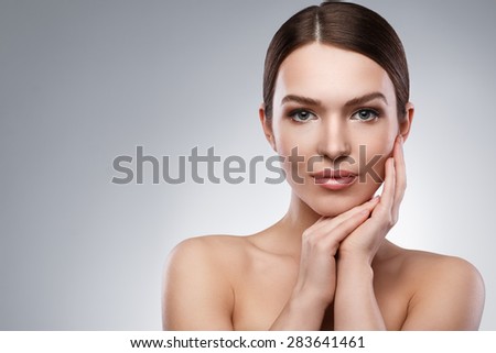 Portrait of young woman with beautiful face and soft skin