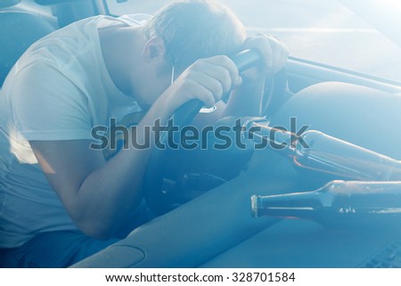 Drunk guy sleeping in the car