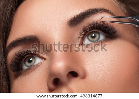 Beautiful woman with eyelash extension for maximum volume