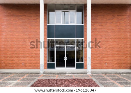 Generic Brick Office Building Front Entrance With Glass Doors, No Signage