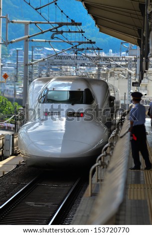 TOKYO, JAPAN - AUGUST 20  Bullet train is arriving into Tokyo station. These high speed trains reaching the speeds over 300Km/h. They are called Shinkansen