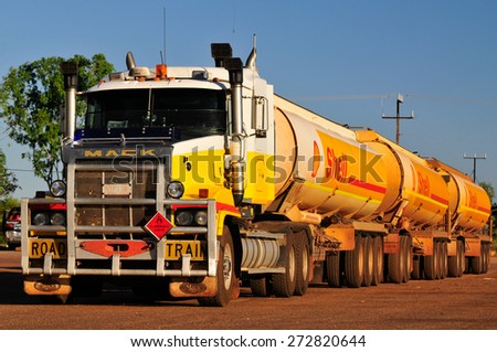 NORTHERN TERRITORY, AUSTRALIA - APRIL 12, 2010: Roadtrains in desert in Northern Territory on April 12, 2010, Australia. A roadtrain use in remote areas of Australia to move freight efficiently.