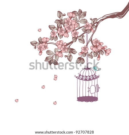 bird cage hanging from cherry blossom branch